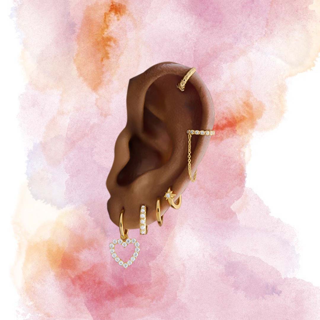 Disembodied ear with a lot, like a lot, of earrings